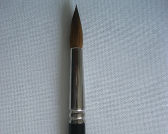 May include: A black and silver paint brush with a brown bristle tip. The brush is labeled "12" and "SOC. INT. CAN. MTL. B."