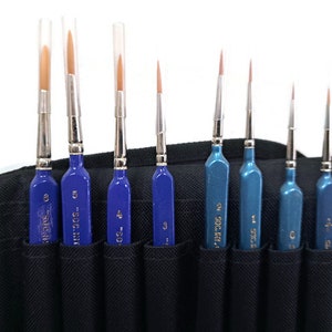 May include: A set of ten paint brushes in a black carrying case. The brushes are numbered 0, 1, 2, 3, 4, 5, 6, 7, 8, and 9. The brushes are blue and silver.