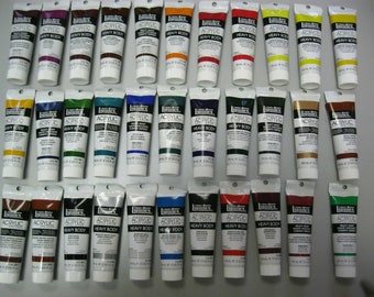 May include: A collection of 30 tubes of Liquitex Professional Acrylic Heavy Body paint. The tubes are arranged in three rows of ten, with each tube containing a different color of paint.