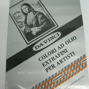 May include: A black and white illustration of the Mona Lisa on a silver background. The text "DAVINCI COLORI AD OLIO EXTRAFINI PER ARTISTI" is printed in black on a white background. The text "FERARIO" is printed in orange on a black background. The text "AZIENDA PRODOTTI ARTISTICI BOLOGNA" is printed in black on a white background.
