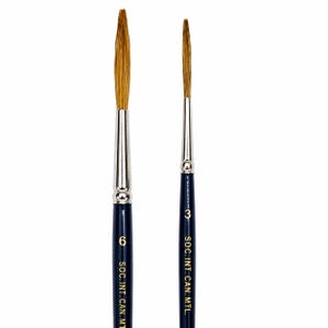 May include: Two round artist paintbrushes with dark blue handles, silver metal ferrules, and light brown bristles. The left brush is marked with the number 6, and the right brush is marked with the number 3. Both feature the text SOC. INT. CAN. MTL.