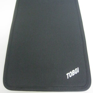 May include: Black laptop sleeve with a white "TOBGI" logo.