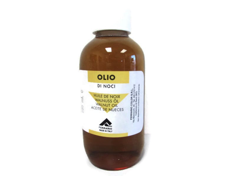 May include: A brown glass bottle of walnut oil with a white label. The label reads "Olio di Noci" and lists the oil's name in several languages. The bottle is made in Italy.