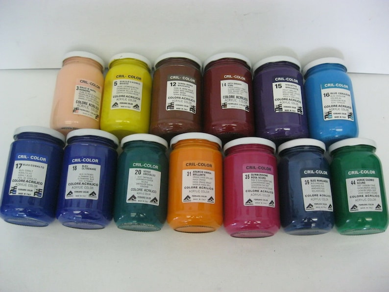 May include: A collection of 12 acrylic paint jars in various colors, including blue, green, red, yellow, orange, and brown. Each jar has a white label with the brand name "CRIL-COLOR" and a number.
