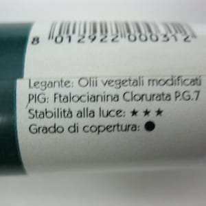 May include: A white tube with a green cap and black text. The text reads: "Legante: Olii vegetali modificati PIG: Ftalocianina Clorurata P.G.7 Stabilit&agrave; alla luce: ★★★ Grado di copertura: ".
