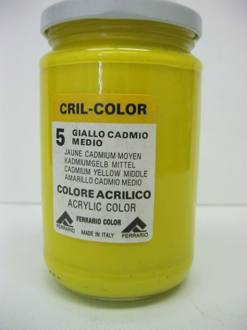 May include: A yellow acrylic paint jar labeled "Cril-Color" with the number 5 and the text "Giallo Cadmio Medio". The jar also includes the text "Colore Acrylico" and "Acrylic Color" in black text. The label also includes the text "Ferrario Color" and "Made in Italy".