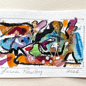 May include: A small rectangular painting on textured paper featuring abstract shapes in orange, blue, purple, green, and black. Thick black ink lines define the composition, with white ink accents and marks. The artist's signature and the year 2026 are visible.