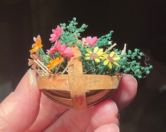 Miniature garden trug basket with flowers