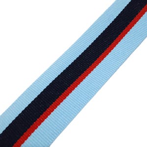 May include: Light blue ribbon with a black and red stripe.
