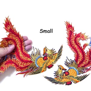 May include: Two embroidered red and gold phoenix patches with the word "Small" printed above them.