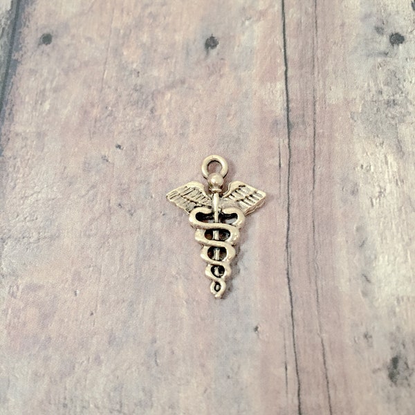 4 Caduceus charms (2 sided) gold toned pewter