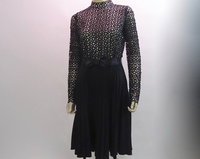 Short black event dress, guipure and crepe. 1960.