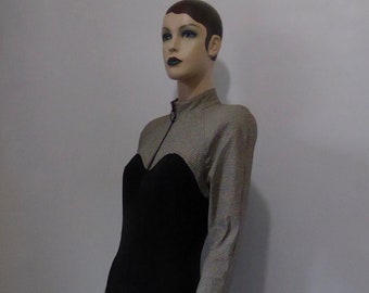 Stretch jumpsuit with shoulder pads in houndstooth pattern. 1980s. New wave clothing. Yuppie