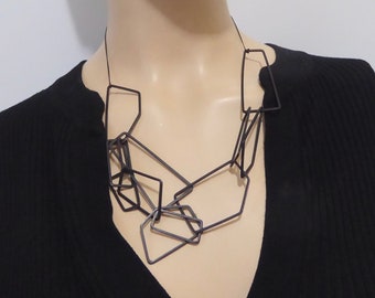 Vintage black painted metal pendant necklace. 90s. Modern style. Modern art necklace. Avant-garde jewelry.