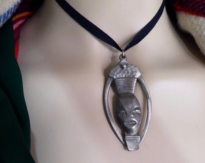 Vintage tribal pendant. African mask. Hammered tinplate. Handmade. African crafts. 1970s.