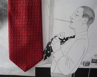 Vintage red tie made of embossed fabric.