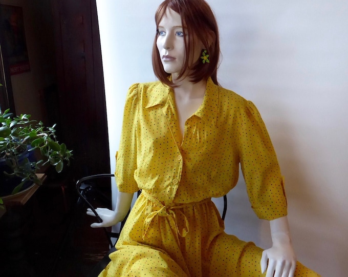 Yellow vintage blouse dress with multicolored polka dots.