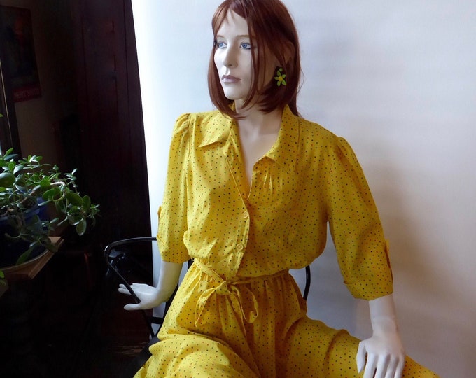 Vintage yellow shirt dress with multi-colored polka dots.