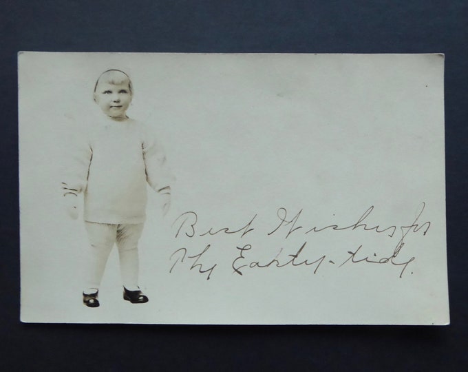 Photograph postcard young child. Victorian. Knitting, hat, gloves, white wool jumpsuit. Franklin green stamp one cent.