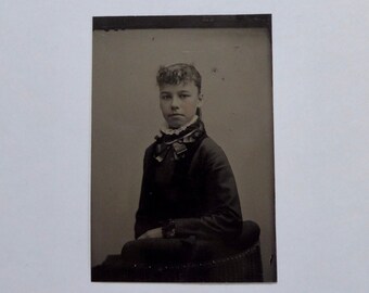 Tintype of a young girl from the Victorian era. 1870.