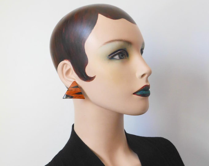 Triangular enamel metal earring with tiger print pattern. Push-back closure. 1990s.