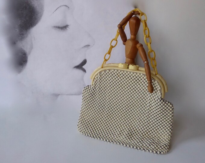Enameled metal mesh and celluloid handbag. Late 1940s. Alumesh Whiting and Davis bags. Made in USA.