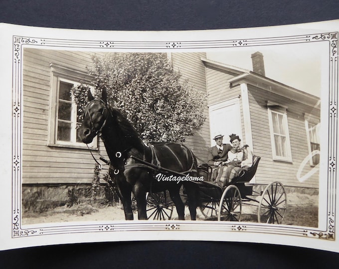 Vintage photo horse and cart. Mother. Son. Centre Quebec 1938. Wooden house. Countryside Quebec. Men's hat. Women's hat.