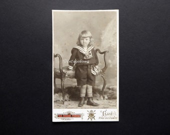 Child photograph 1900. CDV. Sepia. Writing and gold border. Van Damme Frères. Ghent. Photo of young boy long hair sailor suit.