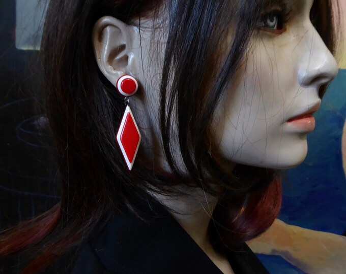 Movable diamond stud earring pendant. Red and white lucite. 1960.