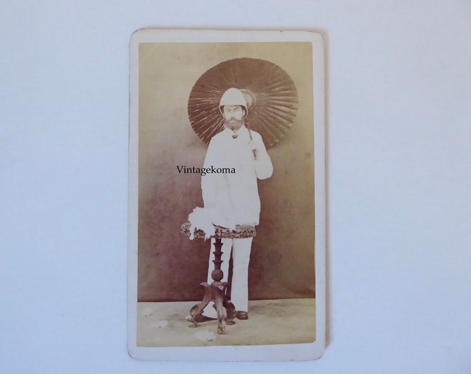 Photo man beard colonial outfit. Original Sepia photograph salacot hat and parasol. Mumbai. Around 1885.