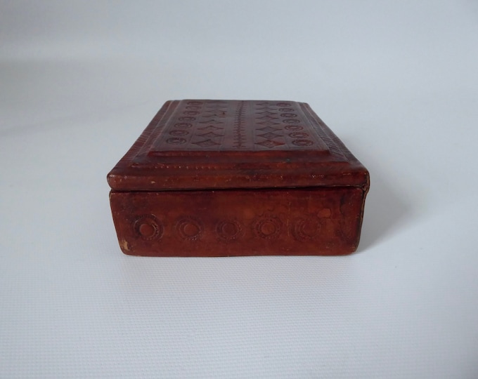 Berber leather box with traditional pattern. Handcrafted wooden box of Tuareg origin. 1970. Ethnic art.