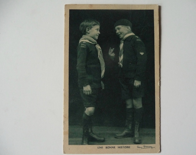 Scouts postcard. Black and white photo. Henri Demay. Caption: A Good Story. Little singers at the Wooden Cross. 1931. Cartophily