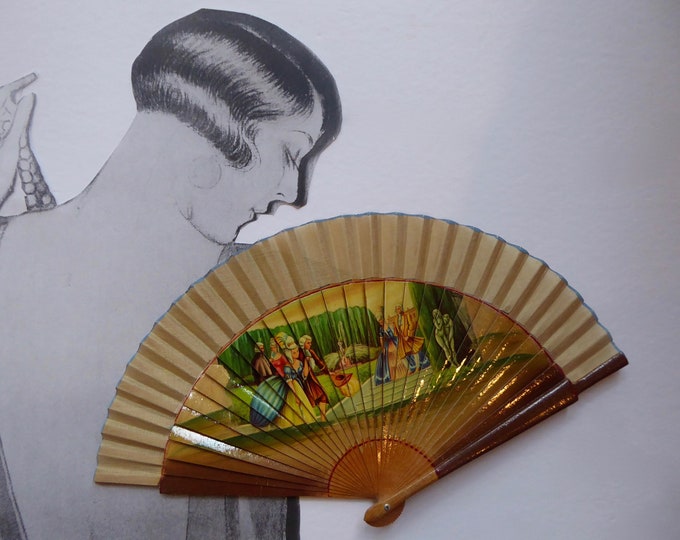 Vintage folded fan.  Year 50. Couples scene in French garden. Courtier. Romantic