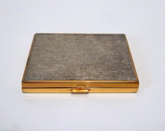 Vintage brass powder compact. Gray textured lid. 1970s.