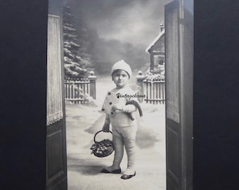 Antique postcard. Little boy carrying luck. Lucky five. Winter. 1910. Holiday season. Poinsettia. Horseshoe. Leggings. Gaiters.