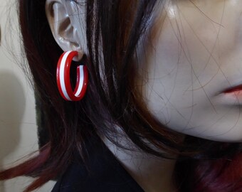 Lucite red and white hoop earrings. 80's.