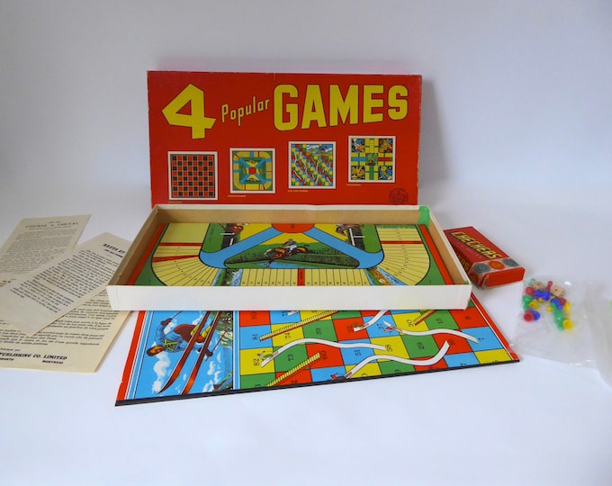 Games Box. 4 popular games. Checkers. Parcheesi. Ladders and snakes. Steeplechase. A Copp Clark Game. 1960