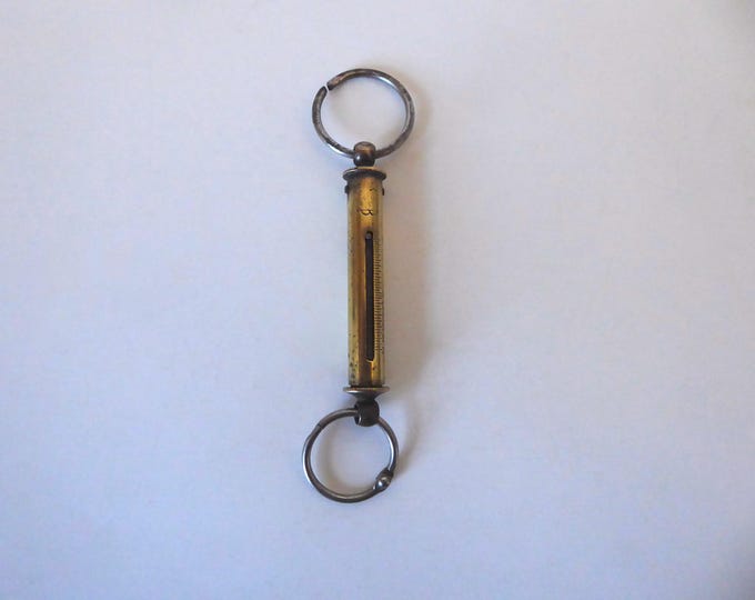 Brass tubular pocket scale. Salter hanging scale. Year 1930-40