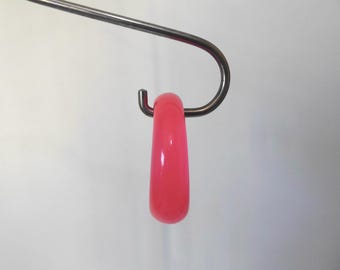 Translucent pink lucite curved bangle bracelet. 1980s. Vintage jewelry.