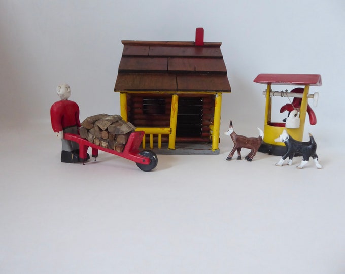 Wood sculpture folk art Canada. Hand carved and painted log cabin. 1940. Man wheelbarrow with dog. Rustic decor.