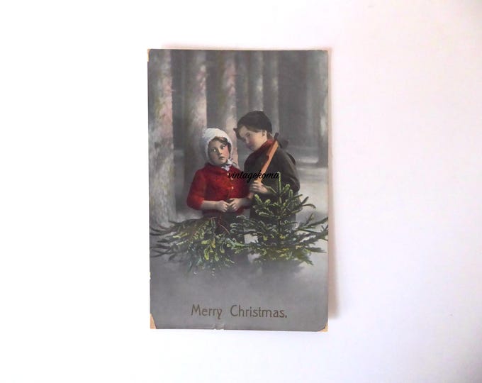 Vintage Christmas Greetings postcard. Children in the woods. 1920