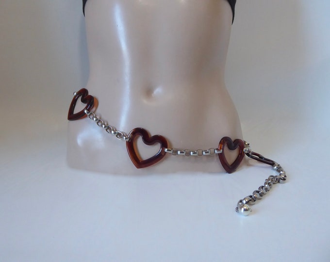 Vintage adjustable belt with chrome chain and lucite heart. Year 80. Carabiner hook closure.