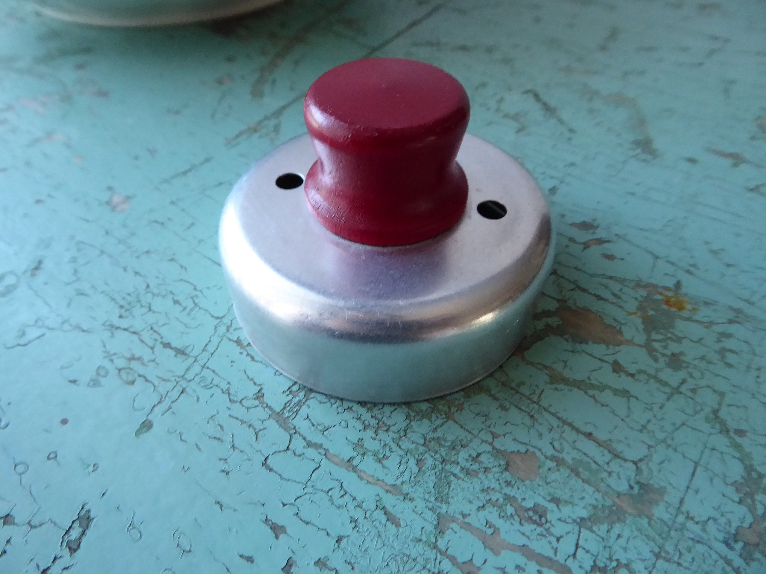 Aluminium vintage doughnut cookiecutter, red wood handle. Year 40/50