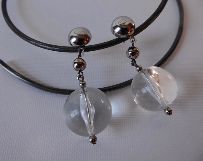 Earring hanging translucent lucite sphere and silver metal ball.  Stroller clasp. Year 70. Space age.