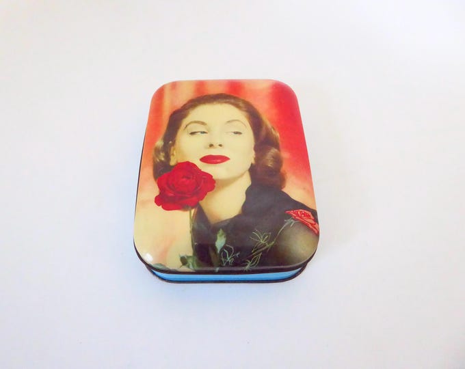 Vintage rectangular metal box with a woman's face. 1950s.
