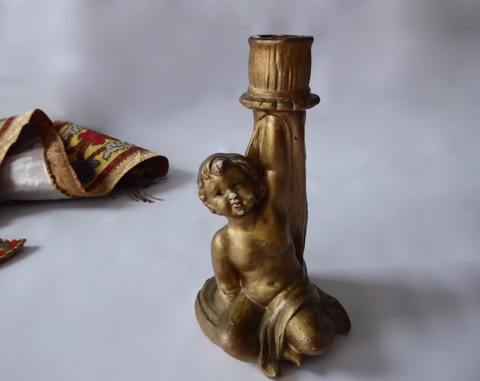 Seated cherub candle holder. Golden plaster. Victorian. Baroque style. Angelot wears candle. Apterous angel. 1910.