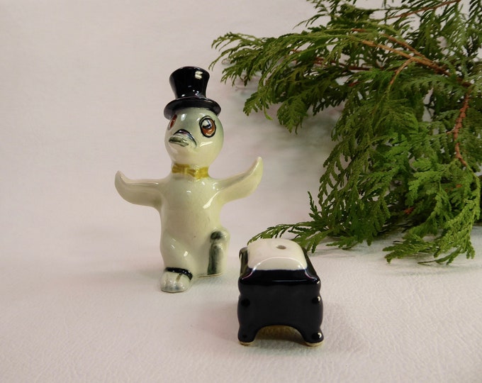 Penguin salt shaker porcelain. Porcelain pepper pouf. Japan. Year 50. Top hat. Tie