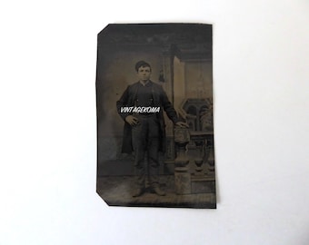 Ferrotype 1 man standing in worker's clothes. Victorian era. 1870. Metal photograph.
