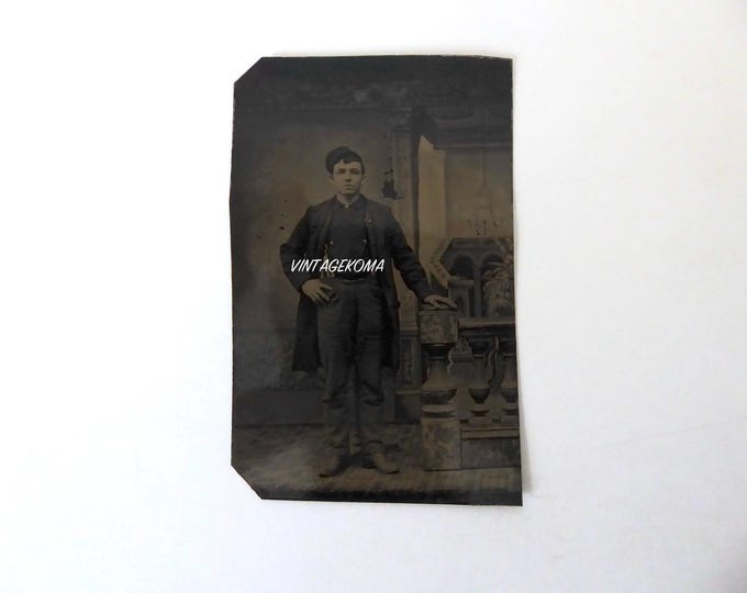 Ferrotype 1 man standing in worker's clothes. Victorian era. 1870. Metal photograph.