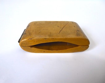 Varnished wooden clapper. Circa 1920. Sound instrument. Religious heritage.